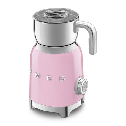 Pink Smeg kettle on a white background