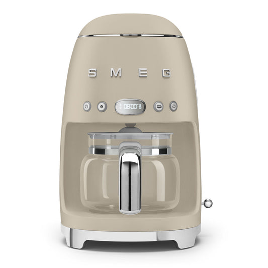 Beige Smeg coffee machine on a white background