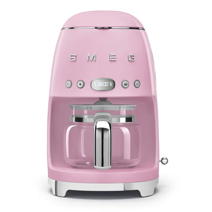 Pink Smeg coffee machine on a white background