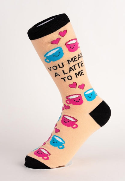 Sock with coffee cup and heart designs on a beige background
