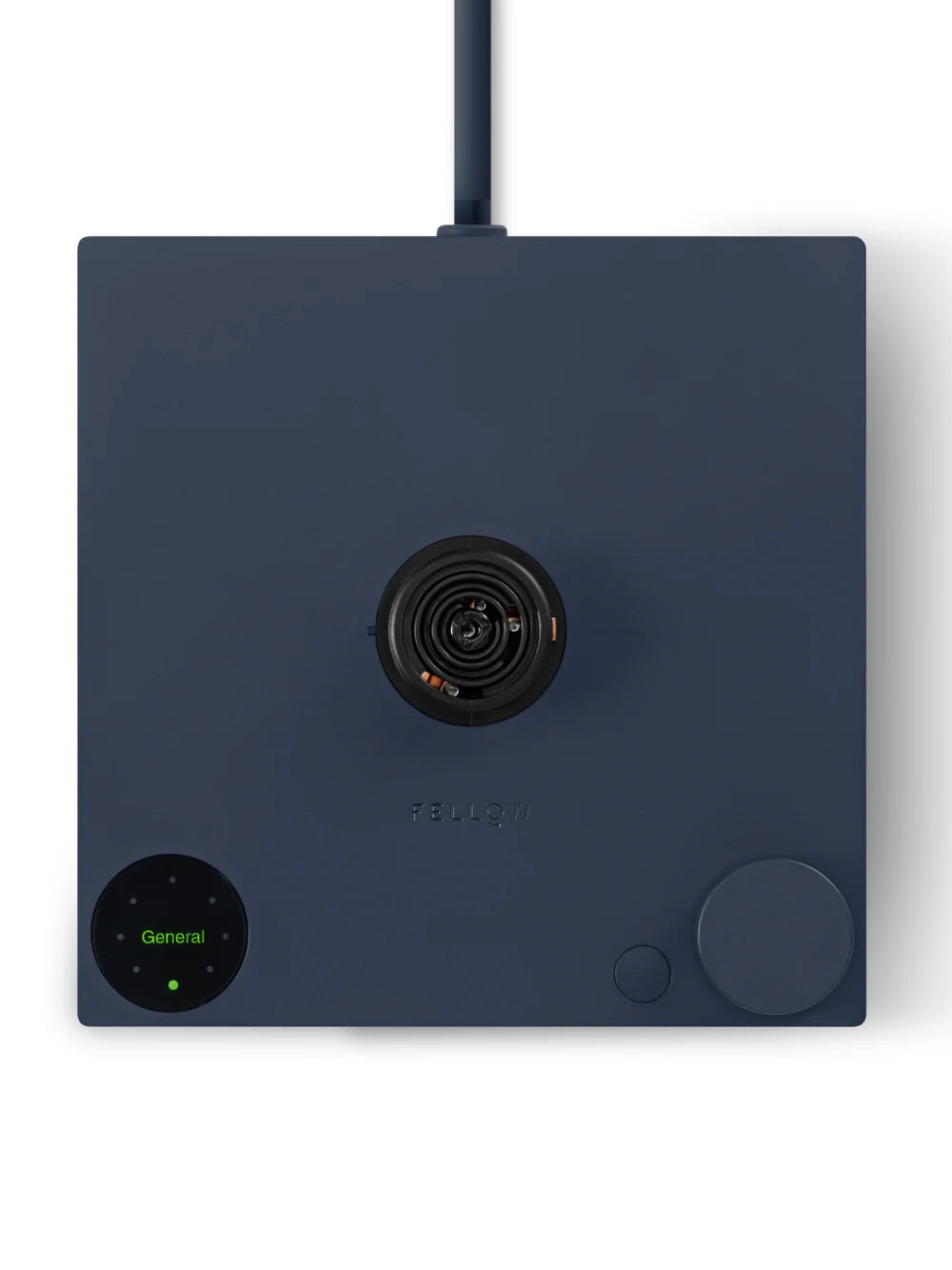 A dark navy blue square electronic device with a central black circular lens, a round green-lit control panel at the bottom left, and a large round dial at the bottom right, shown on a white background.