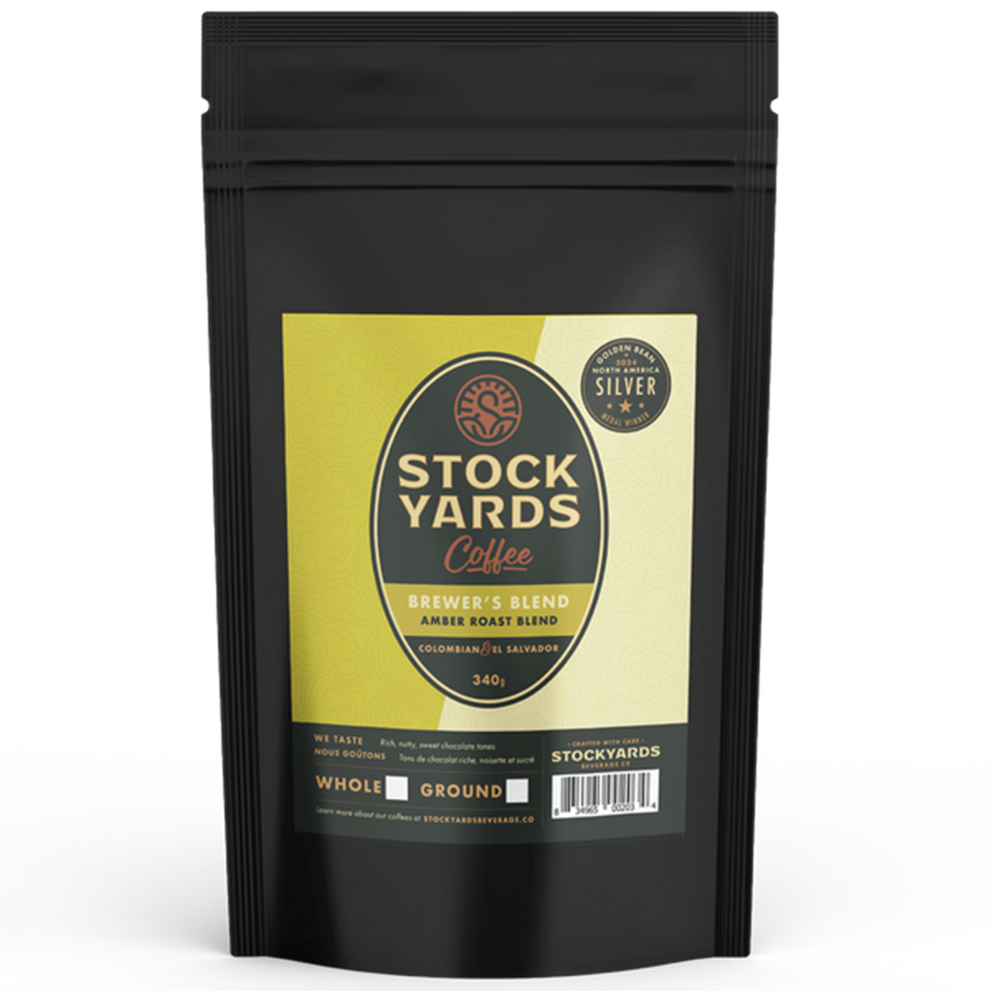 Black coffee packaging with a yellow label featuring 'Stockyards Coffee' on a white background
