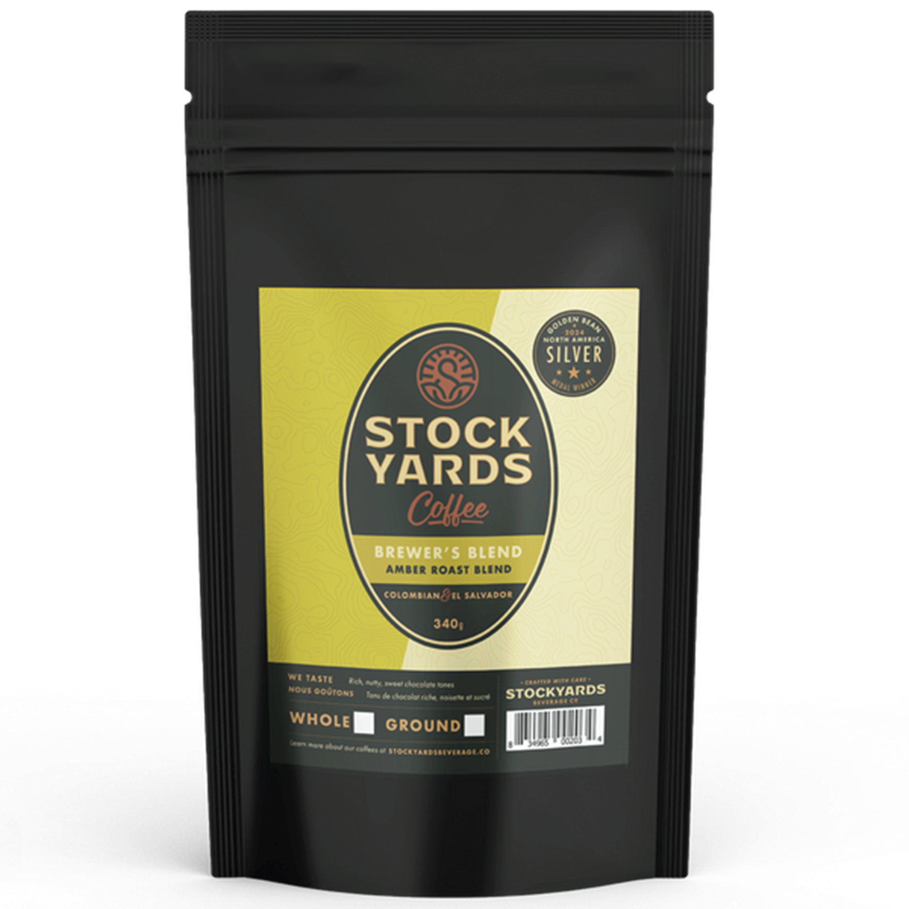 Black coffee packaging with a yellow label featuring 'Stockyards Coffee' on a white background