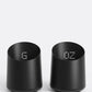 Two black digital coffee dosing cups on a white background