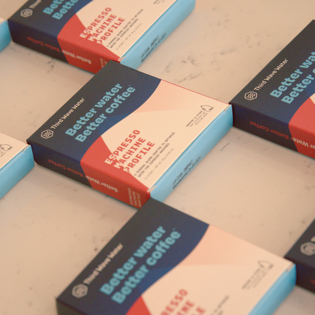 Multiple boxes of Third Wave Water on a light surface