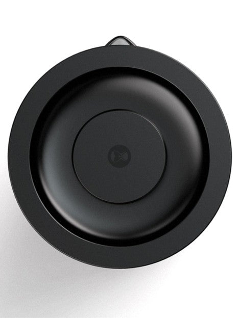 Black round object with a central circular component on a white background