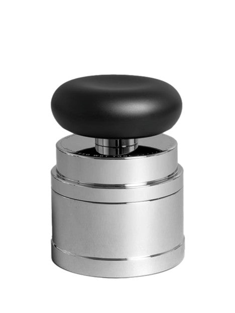 Metallic espresso distribution tool with black top on a white background