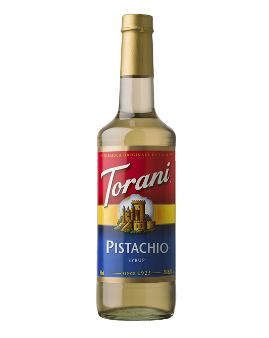 Torani Pistachio syrup bottle on a white background