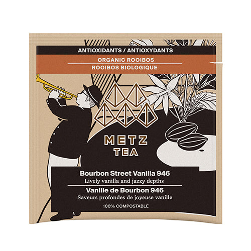 Metz Tea packaging with a silhouette of a person playing a trumpet and tea leaves on a white background.