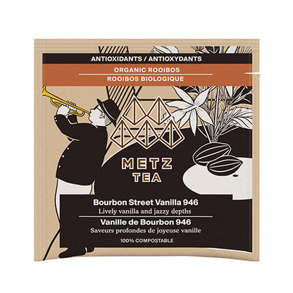 Metz Tea packaging with a silhouette of a person playing a trumpet and tea leaves on a white background.
