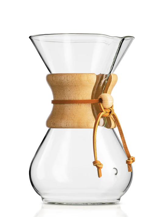 Clear glass coffee maker with wooden collar on a white background