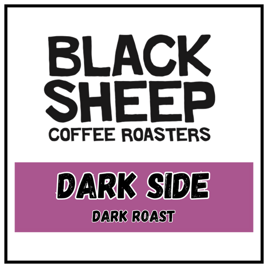 A square coffee roaster label design with a white background, black border, large black text reading 'BLACK SHEEP COFFEE ROASTERS,' and a purple band across the lower half reading 'DARK SIDE DARK ROAST.'.