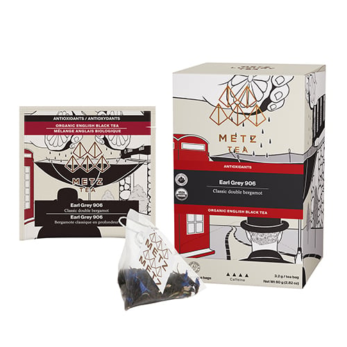 Metz Tea packaging including a box, tea bag, design features a red phone booth with a man wearing a hat on a white background