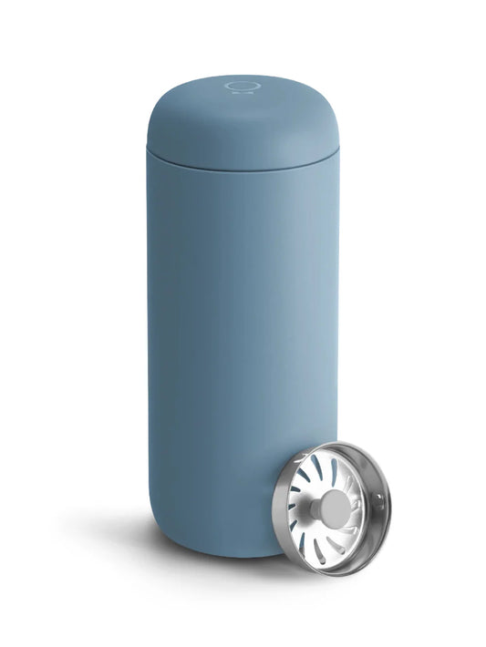 Blue cylindrical travel mug on a white background