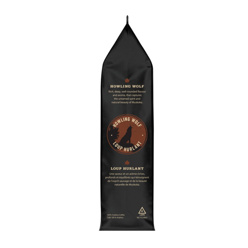 A tall, narrow black stand-up pouch of Howling Wolf Loup Hurlant dog food, shown against a plain white background.