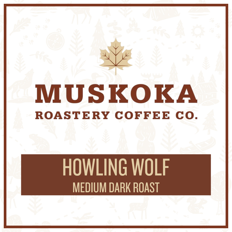 A square coffee label design for Muskoka Roastery Coffee Co. featuring a gold maple leaf above the brand name in brown, with the product name 'Howling Wolf' and 'Medium Dark Roast' on a brown banner at the bottom.