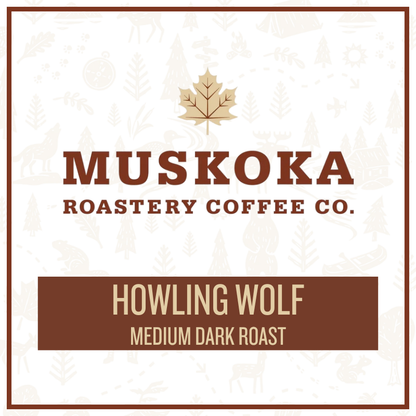 A square coffee label design for Muskoka Roastery Coffee Co. featuring a gold maple leaf above the brand name in brown, with the product name 'Howling Wolf' and 'Medium Dark Roast' on a brown banner at the bottom.