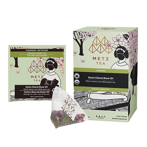 Box of tea with an image of a lady sitting under a cherry blossom tree.