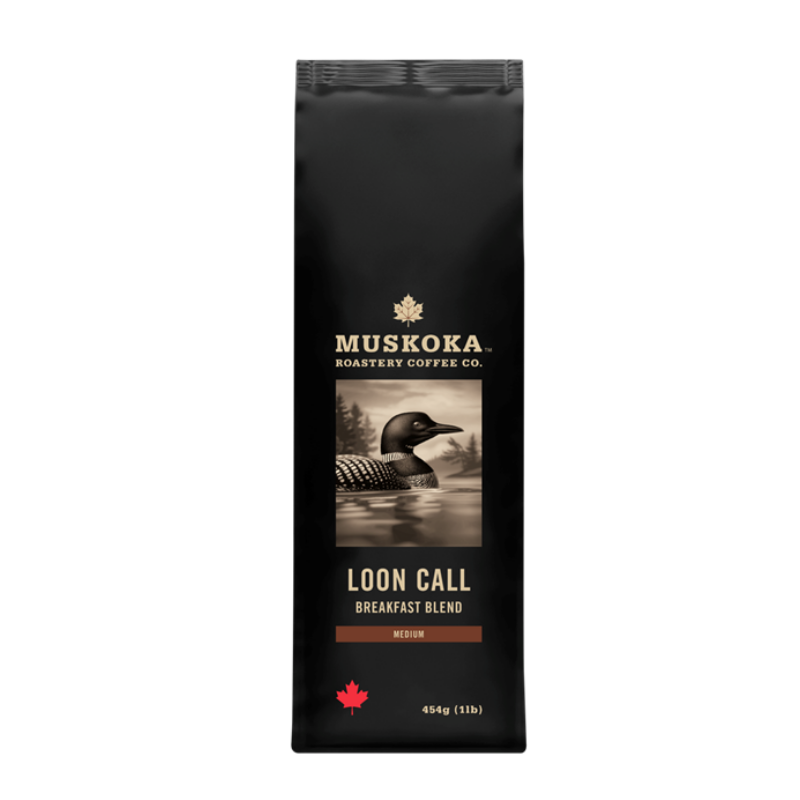 A 454g bag of Muskora Roastery Coffee Co. 'Loon Call' Breakfast Blend medium roast coffee, in a matte black bag with a loon graphic and gold and red text.