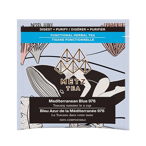Bag of Tea with a women laying on a whale surrounded by coral.