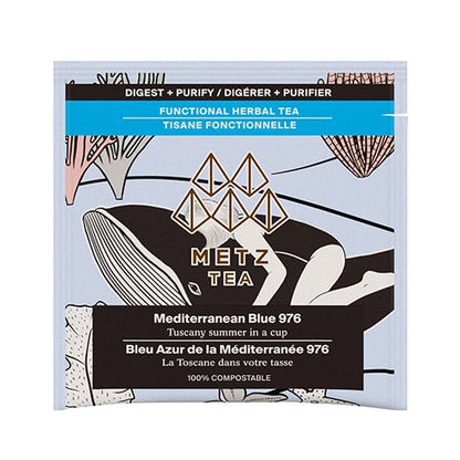 Bag of Tea with a women laying on a whale surrounded by coral.