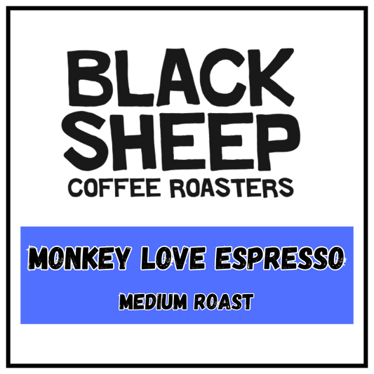 A square coffee label design with a white background, black border, and black text reading 'BLACK SHEEP COFFEE ROASTERS' at the top and 'MONKEY LOVE ESPRESSO MEDIUM ROAST' inside a blue block at the bottom.
