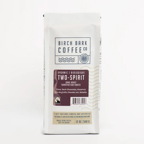 A bag of Birch Bark Coffee Co. Two-Spirit organic biodegradable dark roast coffee on a clean white background.